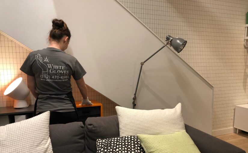 A White Gloves Cleaning Personal in the Apartment