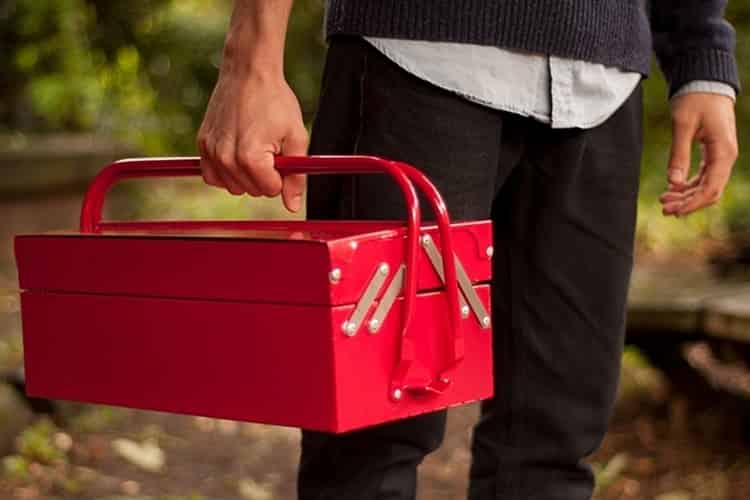 A man with red toolbox