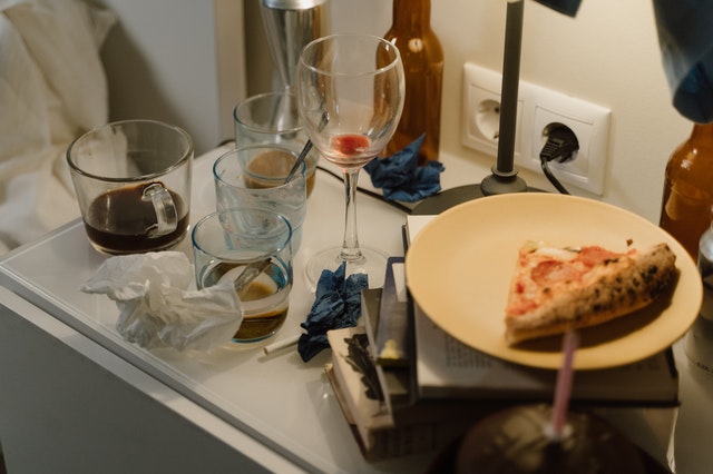 Dirty glasses and plates need cleaning after a New Year’s party.