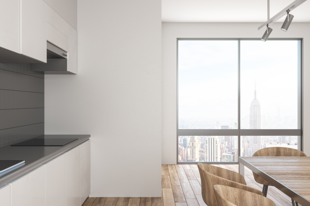 stylish,kitchen,interior,with,panoramic,city,view,,daylight,and,furniture.
