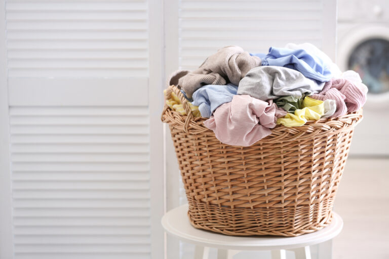 Home wicker,basket,with,dirty,laundry,indoors,,space,for,text
